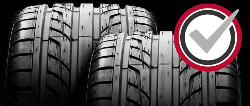 Tire with check mark